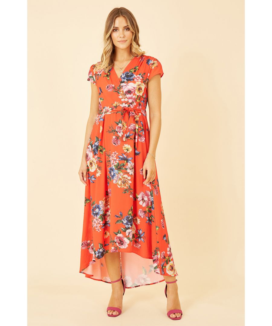An update on our best selling shape. This Mela dress features a midi length dip hem, self tie waist and of course that stunning wrap shape. The all over floral print adds something special to this gorgeous dress. Add some heels and be ready for any invite!