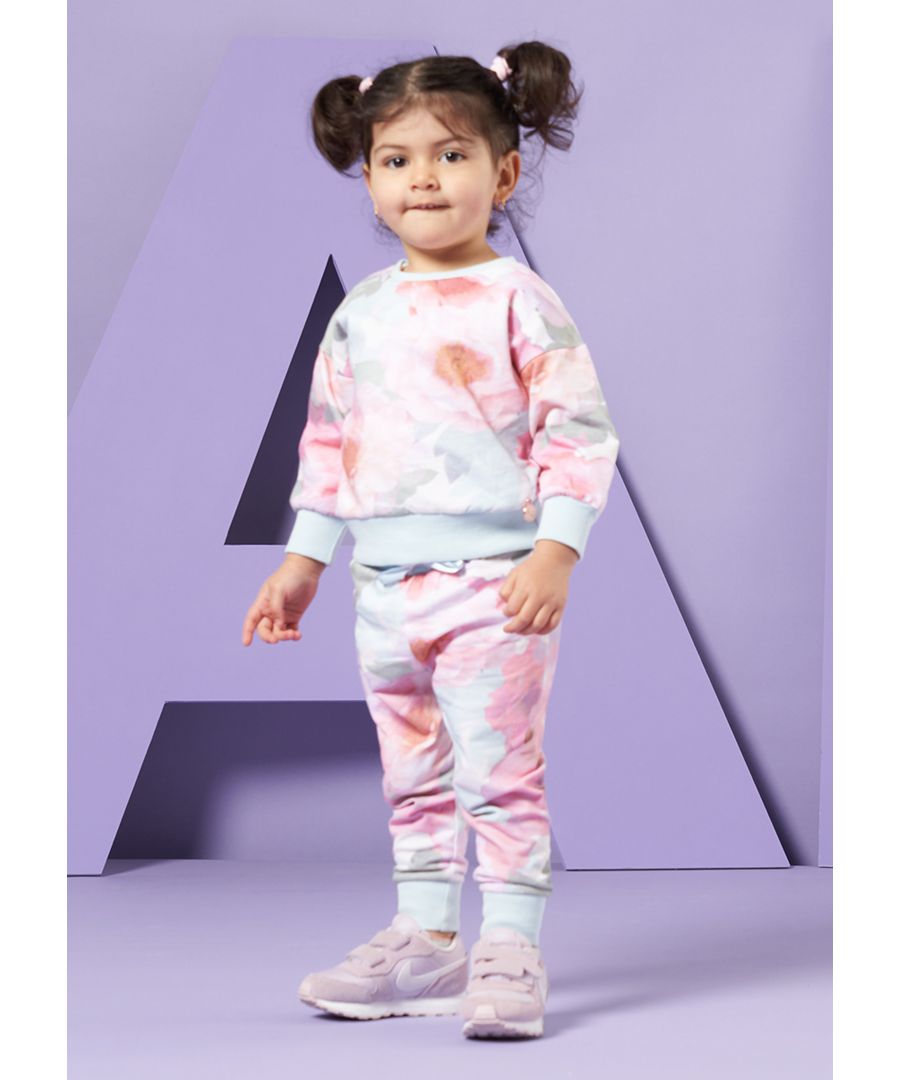 Opt for fun with this super cute sweatshirt and jogger set. Beautiful hand drawn flowers printed on a super soft loopback with a pretty blue rib. What a super cute co-ord.  Angel & Rocket cares - made with Fairtrade cotton   Colour: Pink   About me: 100% Cotton   Look after me – Think planet  wash at 30c