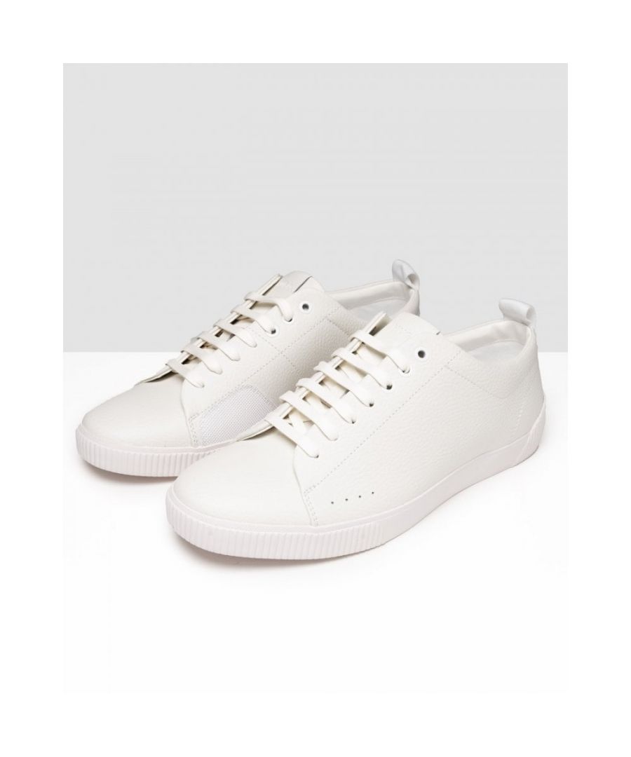 Versatile trainers by HUGO. Featuring a rubber outsole and soft lining, these low-top trainers are crafted in rich leather with a grained effect for refined style. The heel counter is trimmed with logo-jacquard tape.\nLacesFully lined\nUpper material: 100% Cow skin, 100% Polyurethane, 85% Polyester, 15% Polyurethane, Sole: 100% Rubber, Facing: 100% Rubber, Innersole: 100% Polyester