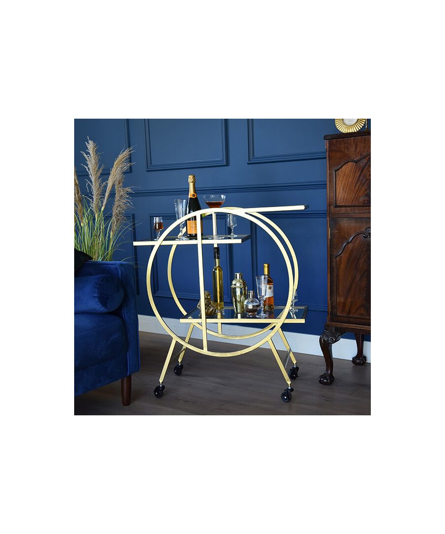 Looking to step up your hosting prowess? Look no further. With this glass drinks trolley, you won’t have to ever choose between ‘going big or going home’ again, because you can do both! Combining modern minimalism with the golden opulence of the roaring ‘20’s, this golden drinks trolley is bound to bring some visual excitement to your home.\n \nWhether you’re looking for extra storage space or hoping to win the next edition of Come Dine with Me, you won’t be wanting to roll this domestic prize away! Flung from the decorous Great Gatsby scene, this bar shelf trolley is oozing with enough space to indulge every guest’s predilection and even comes with a handlebar and wheels for ease of movement. Make every home accessory a statement with this collection.\n \nA sumptuous extra-storage solution, this shelf trolley provides versatility, equally as suited to home bars as home offices, rendered in a timeless, gold art deco design. Wheeled for maximum mobility.\n \nFeatures: \n\n\nTwo glass shelves\n\n\nWheeled base\n\n\nGold body\n\n\n \nProduct specification: \n\n\nProduct Type: Drinks Trollies\n\n\nWeight: 11kgs\n\n\nDimensions: H91.7xW79.5cm x D37cm