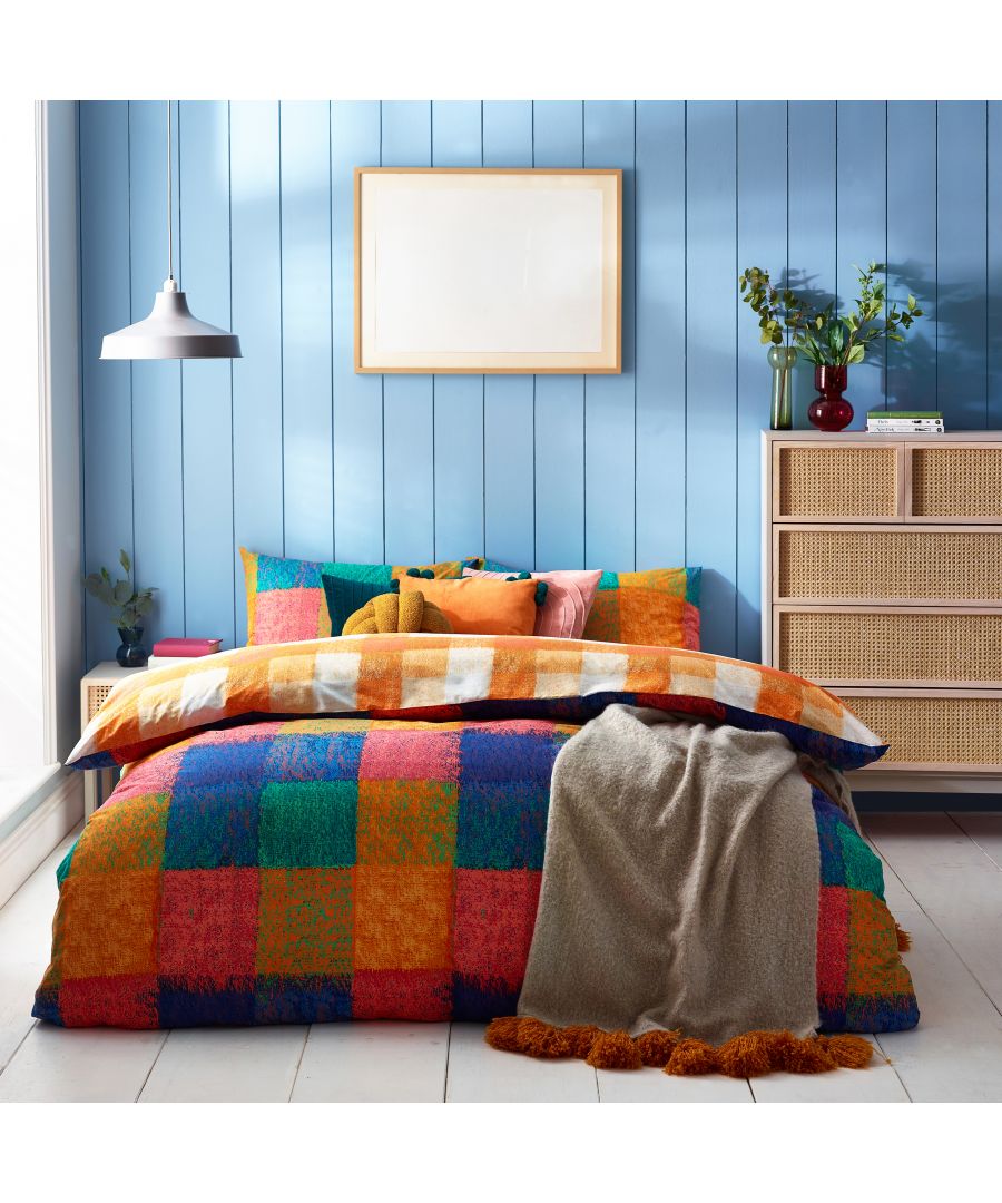 An eye-catching, vibrant check patterned duvet set, featuring soft pastel shades, which is sure to add a pop of colour to your bedroom. The reversible design reveals another orange check design to be used depending on the look you require.