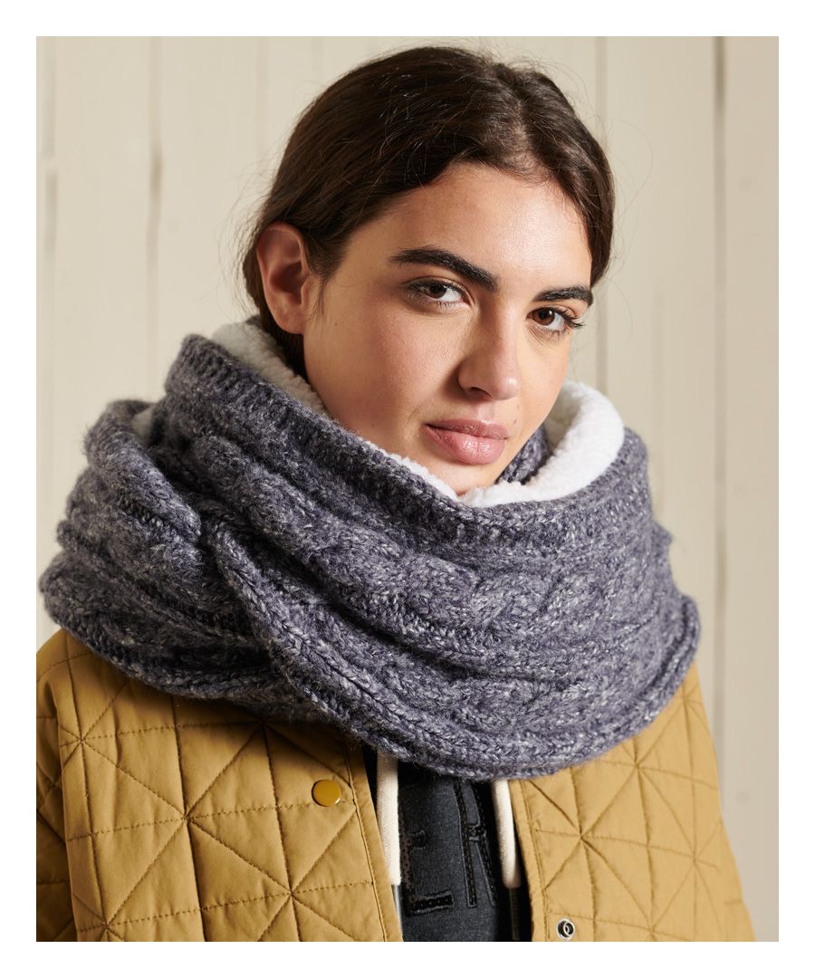 Wrap up in style this season with the Tweed cable snood. This snood is the perfect accessory to any outfit, featuring a cable knit design and a soft Sherpa lining.Cable knit designSherpa liningSignature logo patchL 87cm W 27cm