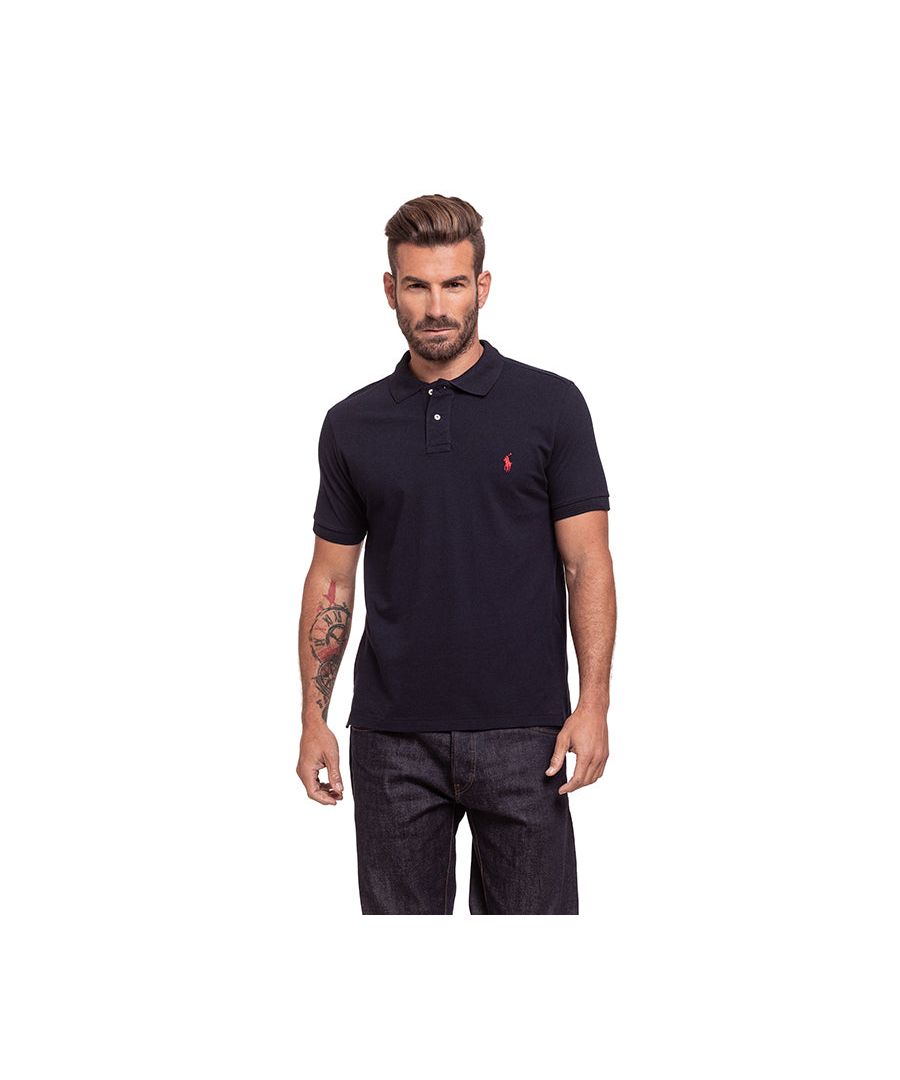 Ralph Lauren Short Sleeve Polo in Navy | 100% cotton. These original men's designer short sleeve Ralph Lauren polos feature the brand's logo and a button-down collared neckline. Crafted With 100% cotton, these lightweight and breathable regular fit polos are suitable for casual or workwear.