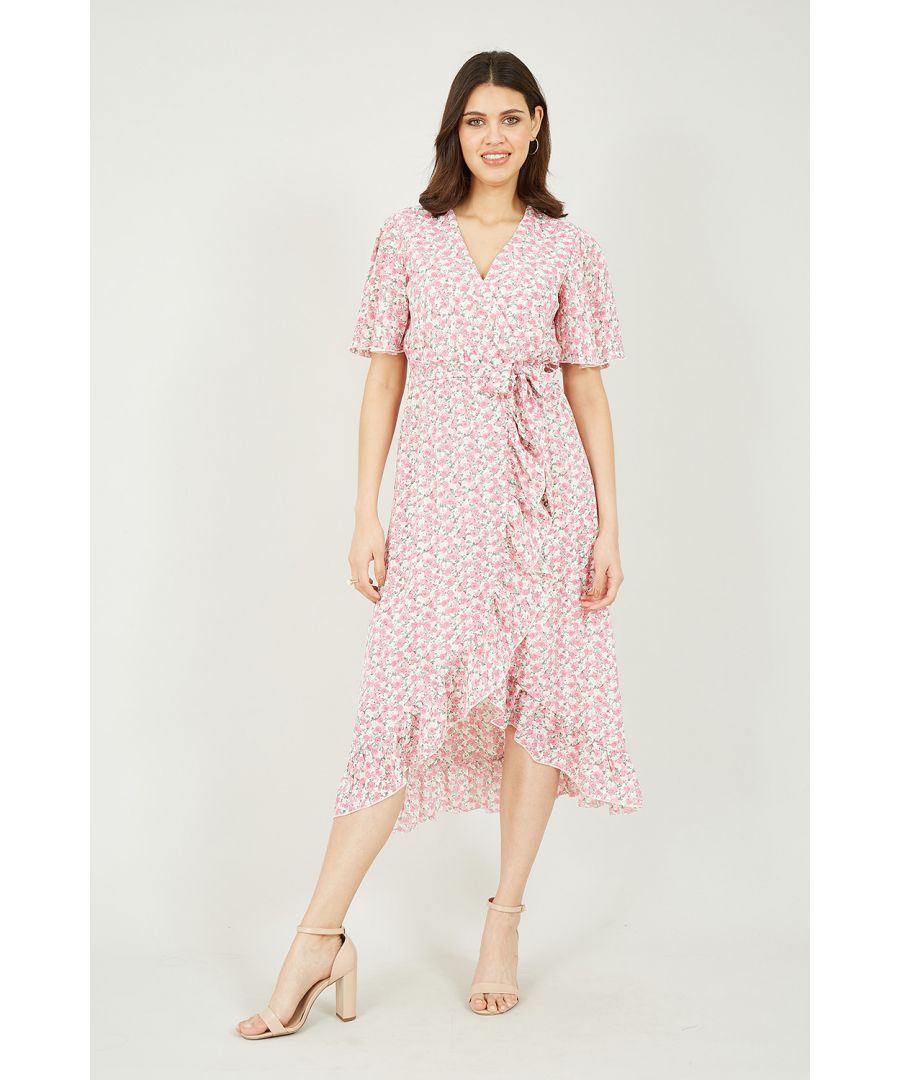 Romance is at the top of the agenda for the Mela Pink Ditsy Floral Wrap Front Midi Dress. The pretty pink and white hues of the ditsy rose print are all wrapped up in a classic wrap shape. The v neckline and frilly sleeves add a flirty feel to this piece, with the ruffle running from waist to hem adding even more dreamy detailing. Wear with complimenting silver jewellery and accessories to make it feel like valentines any day of the year.