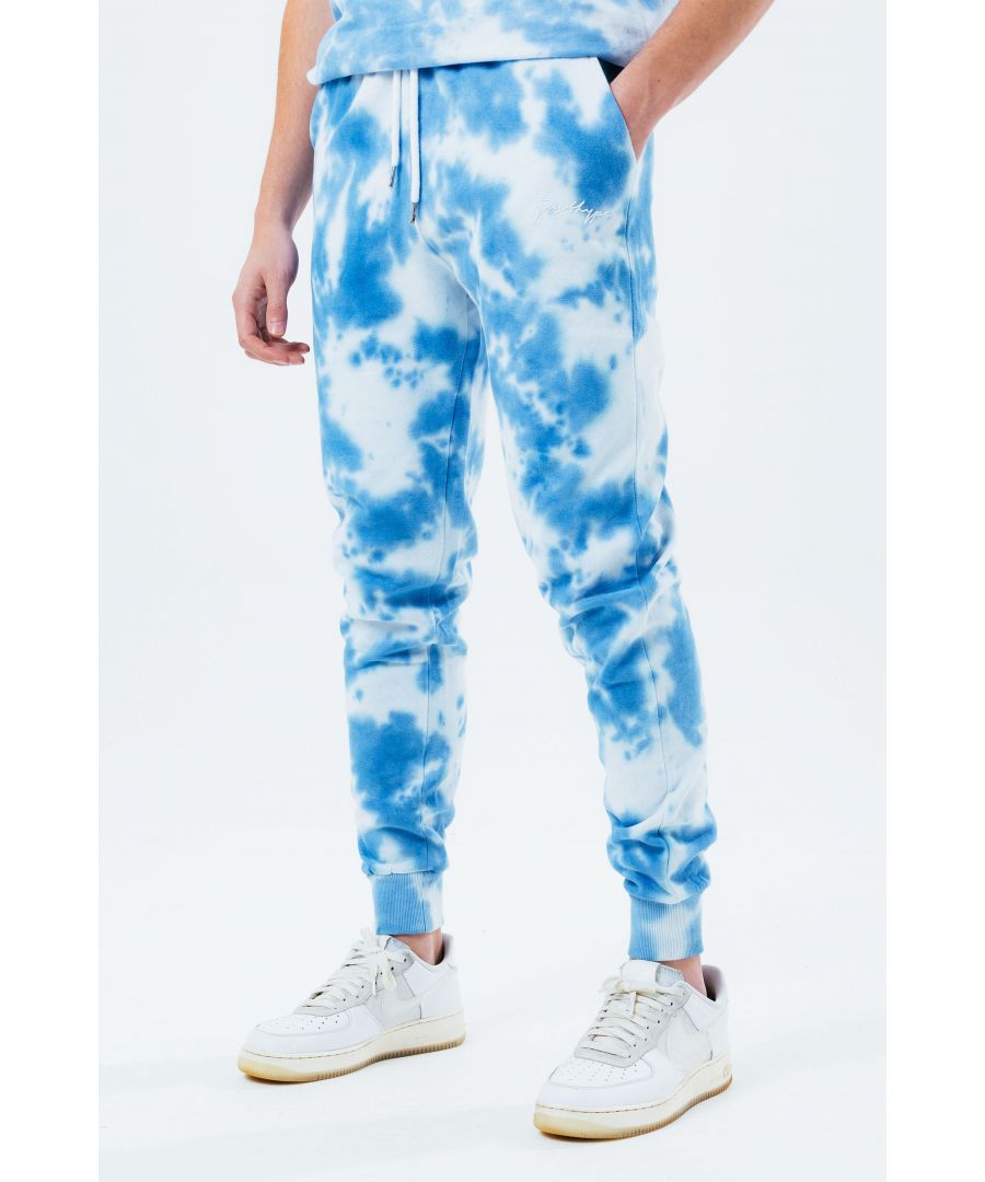 Stay on trend with the Hype Navy Tie Dye Scribble Logo Men's Joggers and grab the matching hoodie to complete the set. Designed in a soft-touch 70% Cotton 30% Polyester fabric base with the supreme amount of comfort you need from your new joggers. The design boasts an acid wash or tie-dye wash finish with an elasticated waistband, drawstring pullers and fitted cuffs. Machine wash at 30 degrees.