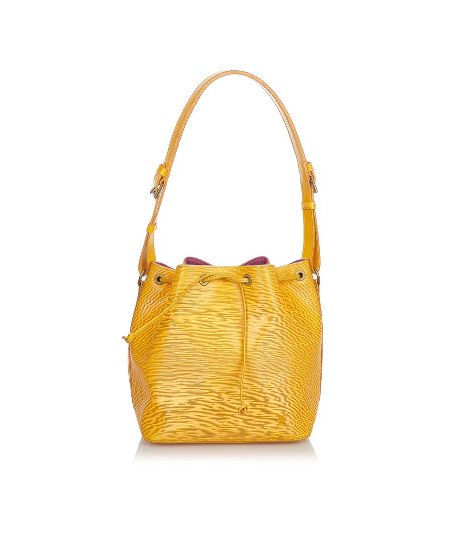 VINTAGE. RRP AS NEW. The Petit Noe features Epi leather, an adjustable shoulder strap, a drawstring closure, Alcantara lining, and an interior zip pocket.Exterior back is scratched and stained. Exterior bottom is scratched and stained. Exterior corners is scratched. Exterior front is scratched and stained. Exterior handle is cracked and stained. Exterior side is stained. Buckle is scratched and tarnished. Screw is rusty and tarnished. Interior lining is scratched.\n\nDimensions:\nLength 26.5cm\nWidth 24.5cm\nDepth 19cm\nShoulder Drop 27cm\n\nOriginal Accessories: This item has no other original accessories.\n\nSerial Number: AR 0954\nColor: Yellow\nMaterial: Leather x Epi Leather\nCountry of Origin: FRANCE\nBoutique Reference: SSU166276K1342\n\n\nProduct Rating: GoodCondition\n\nCertificate of Authenticity is available upon request with no extra fee required. Please contact our customer service team.