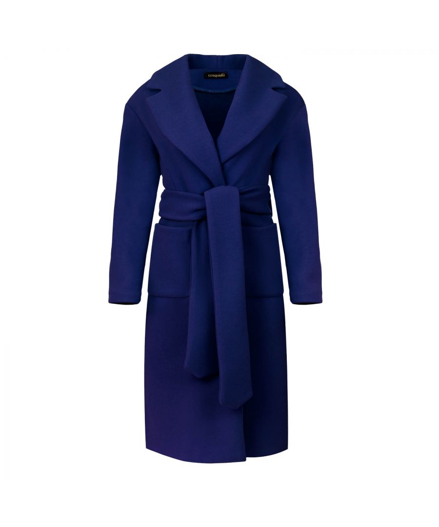 This long electric blue coat is crafted in faux mouflon style fabric. There are large square patch pockets on either side. It has a large lapel and drop shoulders. The coat fastens in the front with 2 large black plastic buttons. At the waist it has belt loops on the left and right so that it can be worn with the 9cm wide belt which is in the same fabric. The coat has big slits on either side. It is styled in a straight silhouette. This piece is ideal for wear in the day or for an evening out.