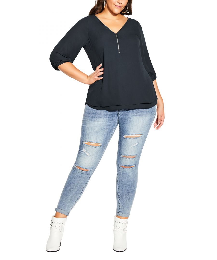 Work and play with unflappable confidence in the Sexy Fling Elbow Sleeve Top. A gorgeous zip neckline adds glamour to this must-have shape, finished with 3/4 length elasticated sleeves and a layered front. Key Features Include: - Workable zip neckline - Darted bust - Double layer front - 3/4 length sleeves with elastic cuff - Relaxed fit - Hip length hemline - Lightweight woven fabrication