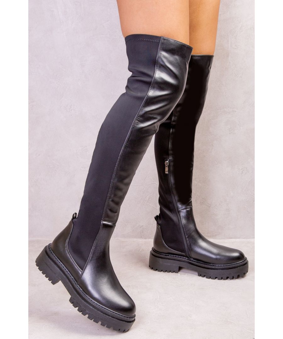 The Elena Chunky Over the Knee Stretch Boot is made from black patent faux leather and features a chunky design with a wide block heel. Side zip detail on the side of the boot gives it extra glamour. It's perfect for any time of year and can be worn to work or out on the weekend - keeping your look at the top of trends!