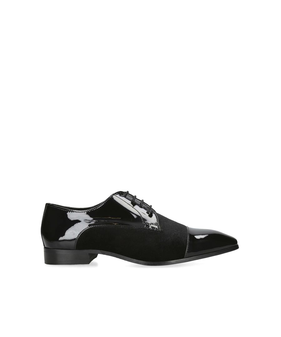 The Samy is a formal shoe crafted from a black patent material leather with laces up the front panel.