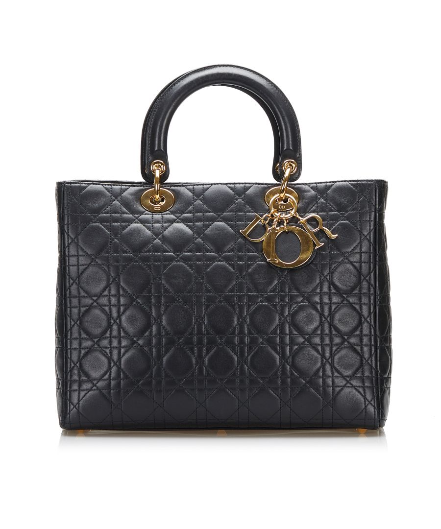 VINTAGE. RRP AS NEW. The Lady Dior features a quilted lambskin leather body, flat top handles, a detachable flat leather strap, a top zip closure, and an interior zip pocket.Exterior Front Out Of Shape, Worn. Exterior Back Out Of Shape, Worn. Exterior Bottom Out Of Shape, Worn. Exterior Bottom stained with Other. Exterior Handle Worn. Practical Attachment Scratched. Zipper Scratched. \n\nDimensions:\nLength 24cm\nWidth 30cm\nDepth 10cm\nHand Drop 10cm\nShoulder Drop 44cm\n\nOriginal Accessories: Dust Bag, Authenticity Card\n\nColor: Black\nMaterial: Leather x Lambskin Leather\nCountry of Origin: Italy\nBoutique Reference: SSU193349K1342\n\n\nProduct Rating: GoodCondition\n\nCertificate of Authenticity is available upon request with no extra fee required. Please contact our customer service team.