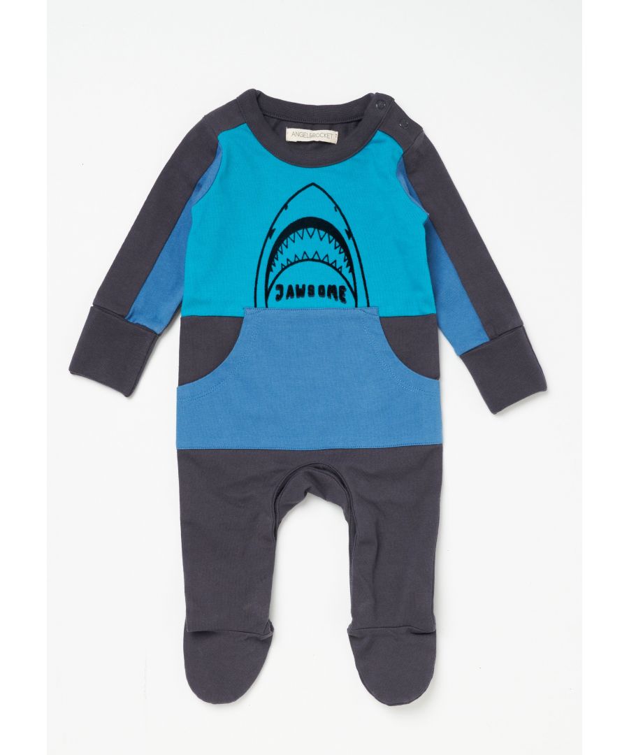 Watch out he's coming! This colour blocked onesie with flocked shark graphic is perfect for your little one to cuddle up in. With matching reversible dribble bib. Made in super soft cotton jersey with popper leg opening for easy fuss free dressing and logo print on the feet.     Angel & Rocket cares – made with fairtrade cotton     Colour: Navy / Blue   About me: 100% cotton.   Look after me – Think planet  wash at 30c.