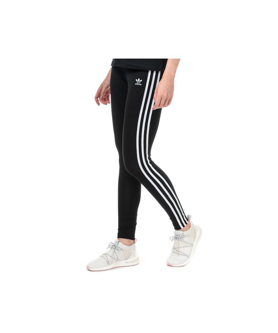Womens adidas Originals 3-Stripes Leggings in black.Soft  stretchy leggings.- Elasticated stretch waist.- Applied 3-Stripes to sides crafted from textured grosgrain ribbon.- Embroidered Trefoil and adidas wordmark at left thigh.- Tight fit.- Inside leg length measures 29“ approximately.  - Main material: 93% Cotton  7% Elastane.  Machine washable.- Ref: CE2441Measurements are intended for guidance only.