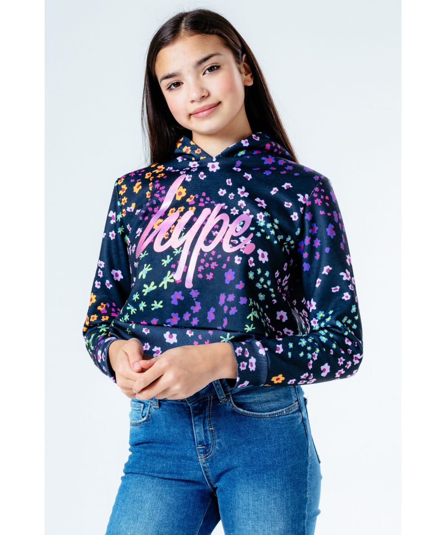 The cutest crop hoodie you'll need this season, and every season after that. The HYPE. Floral Ditsy Kids Crop Pullover Hoodie. The fabric boasts a 100% polyester base for the upmost comfort, in an all-over floral inspired print in a black, pink, green and purple colour palette. With a fixed hood and fitted hem and cuffs. Finished with the iconic HYPE. script logo in a contrasting pastel rainbow across the front. Wear with cycle shorts to stay on trend this season. Machine wash at 30 degrees.