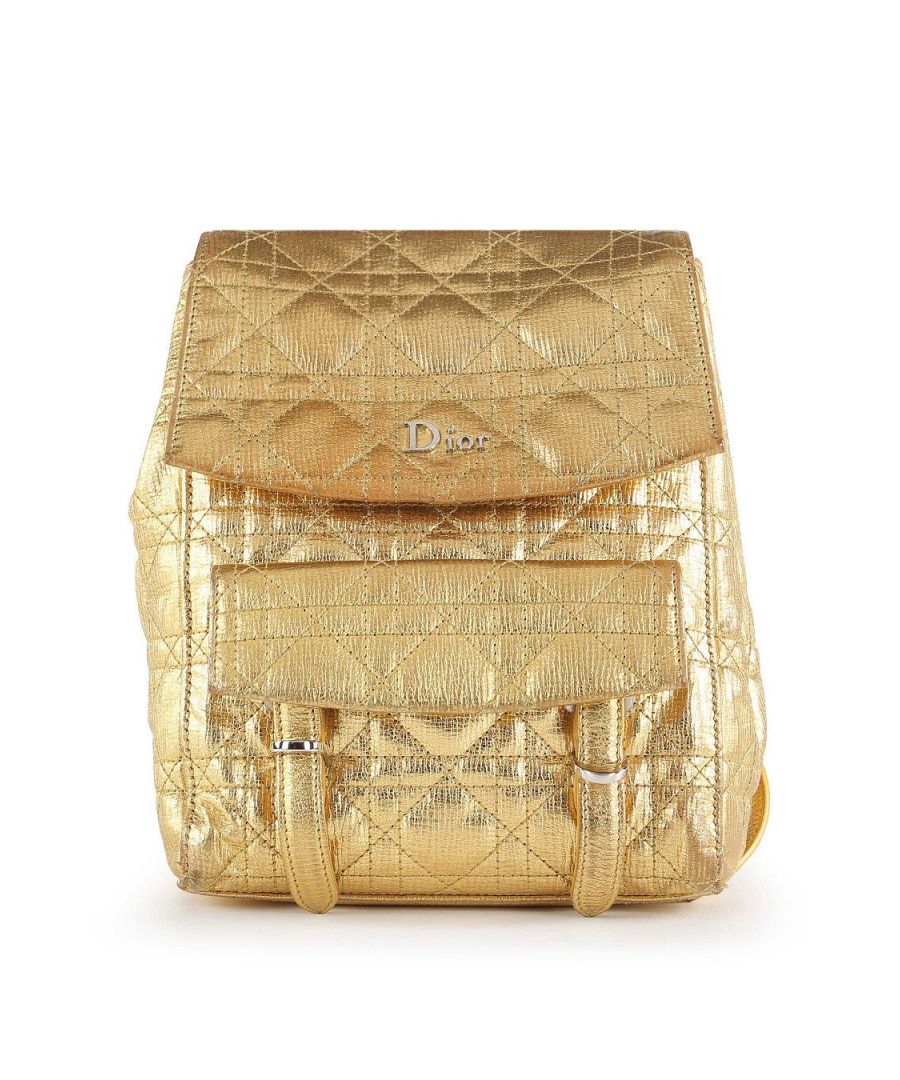VINTAGE, RRP AS NEW\nThis Dior backpack is crafted from gold shiny cannage leather. The bag features single top rolled handles with D logo adornment, double adjustable flat shoulder strap, one patch pocket at the back, one double buckle closure pocket at the front, front flap with magnetic button snap closure that opens to a brown stripped fabric lined interior compartment with one slit pocket, and gold tone hardware. The bag is in very good condition, yet the leather has scratches and scuffs all throughout and the hardware shows hairline scratches. The interior is intact. Product Code: 17-B0-1106.\nDior Dior Stardust Gold Leather Cannage Backpack\nColor: gold\nMaterial: Leather\nCondition: very good\nSize: One Size \nSign of wear: No\nSKU: 158134 / GLB-6231 / GLB-6231 \nDimensions:  Length: 240 mm, Width: 70 mm, Height: 170 mm