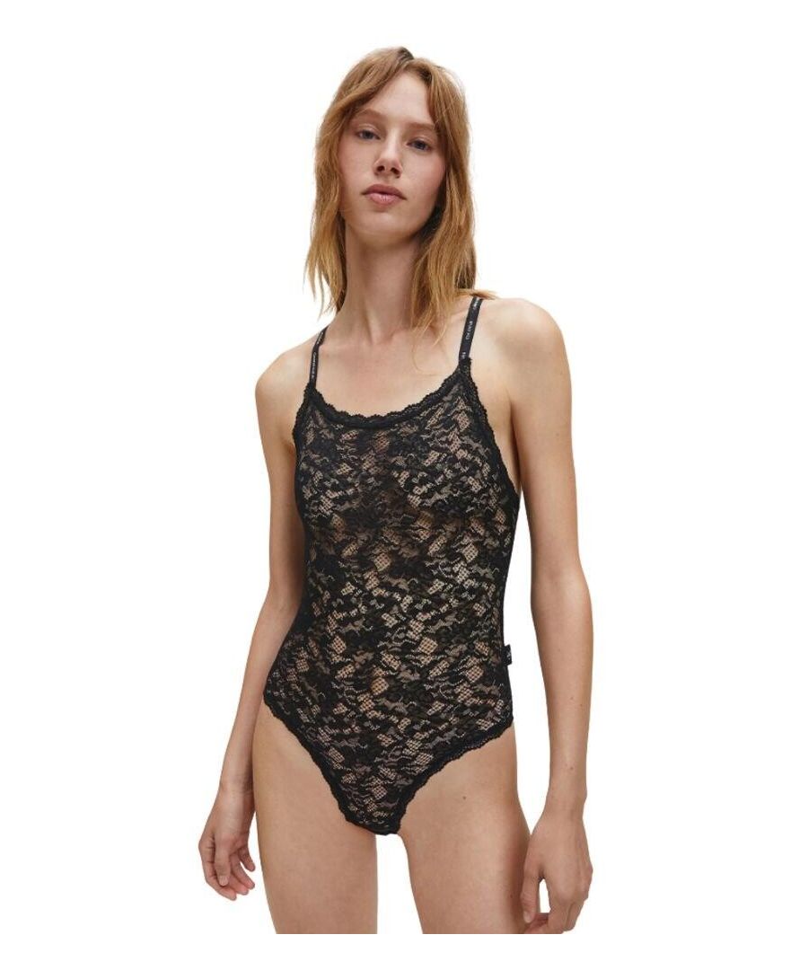 Reinvent sensuality with this CK One bodysuit from Calvin Klein. Crafted from semi-sheer stretch lace, this piece will give you an eye-catching and flirty look, whilst also being able to adapt to your figure. It features no cups for a truly natural look, whilst also giving you the support you need with adjustable straps that can be converted to cross-back style. A snap fastening at the base makes for easy wear.\n\nSensual and feminine design\nSemi-sheer stretch lace\nNo cups,\nNo padding or lining\nAdjustable, multi-way straps\nSnap fastening at base\nScalloped lace trims\nCalvin Klein branding\nComposition: 90% Nylon | 10% Elastane\nListed in UK sizes