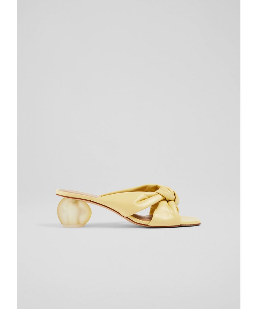 A brand-new style for us this summer, our Jolene mules are chic, contemporary and lots of fun. Crafted in Spain from buttery-soft lemon yellow nappa leather, they crossover at the front, are open at the back and sit on a playful, oval-shaped heel in lemon perspex. Wear them with your favourite dresses when the sun shines.