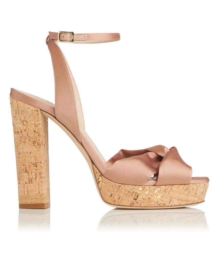 Lift your look this events season with the retro cool of Annabella, our vintage-inspired summer sandals. Beautifully designed with a luxurious rose satin peep-toe and a chunky cork platform, this sun-ready shoe is set to become your new suitcase (and party) essential. Celebrate the sunshine in style this season...