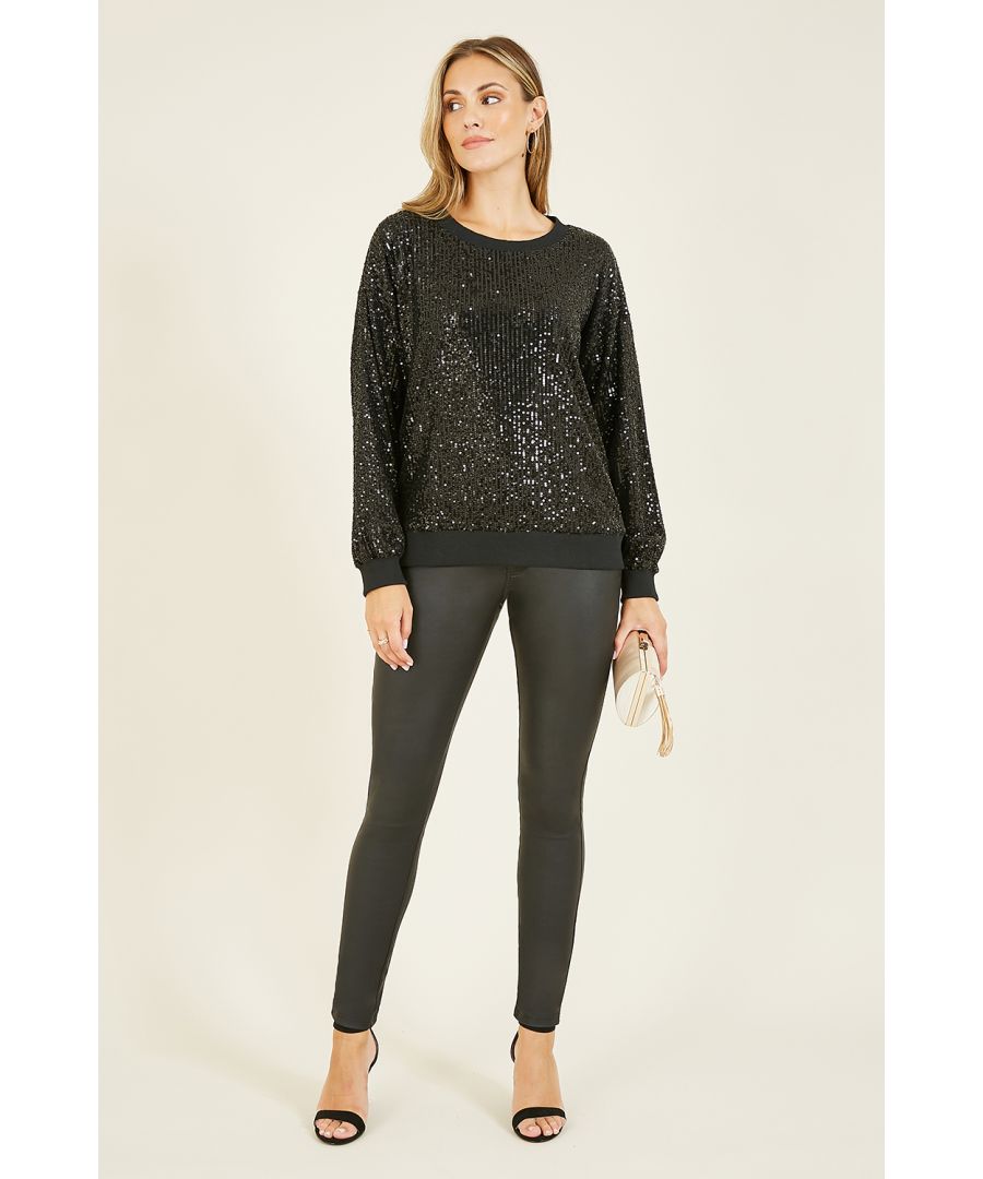 Sparkle this season in this stunning Yumi Black Sequin Sweatshirt. Easy to match and adds a touch of glam to any fit. With black block edging, all over sequin detailing and lined inside for a comfy, stand out finish. Great matched with wide legged trousers and a leather jacket.
