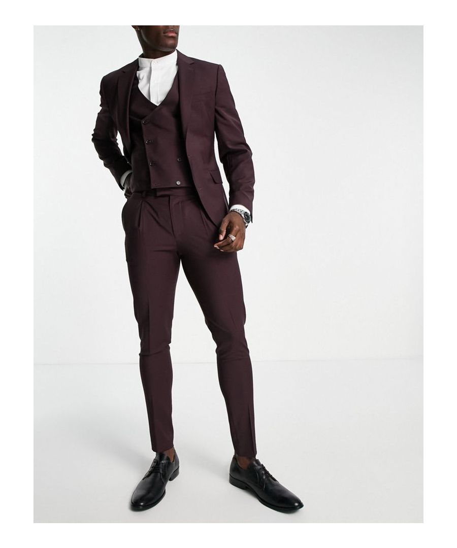 Suit trousers by Noak Effort: made Regular rise Belt loops Internal pocket to waistband Side pockets Faux-back pockets Stab-stitching Super-skinny fit Sold by Asos
