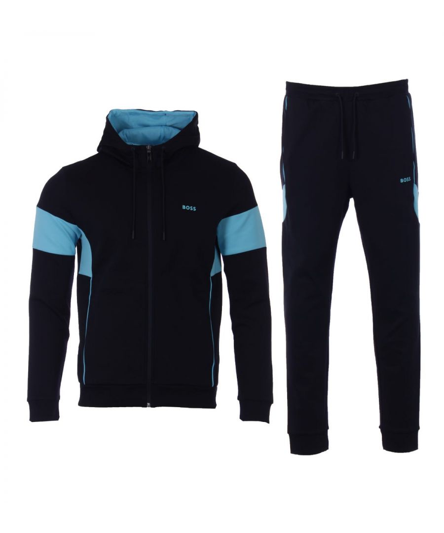 This modern tracksuit from BOSS Athleisure is the perfect piece to elevate your wardrobe with a sporty appeal. Crafted from cotton-rich interlock fabric providing a smooth feel, solidifying that sporty look. Featuring a zip through hooded sweatshirt and drawstring waist joggers. Both are detailed with contrasting inserts and piping for a characterful effect. Signature BOSS branding can be found on both pieces for that classic BOSS finish.Regular Fit, Stretch Cotton Blend Interlock Fabric, Zip Through Hooded Sweatshirt, Drawstring Waist Joggers, Pockets & Ribbed Trims , Contrast Inserts & PipingBOSS Branding. Style & Fit:Regular Fit, Fits True to Size. Composition & Care:80% Cotton, 15% Polyester, 5% Elastane, Machine Wash.