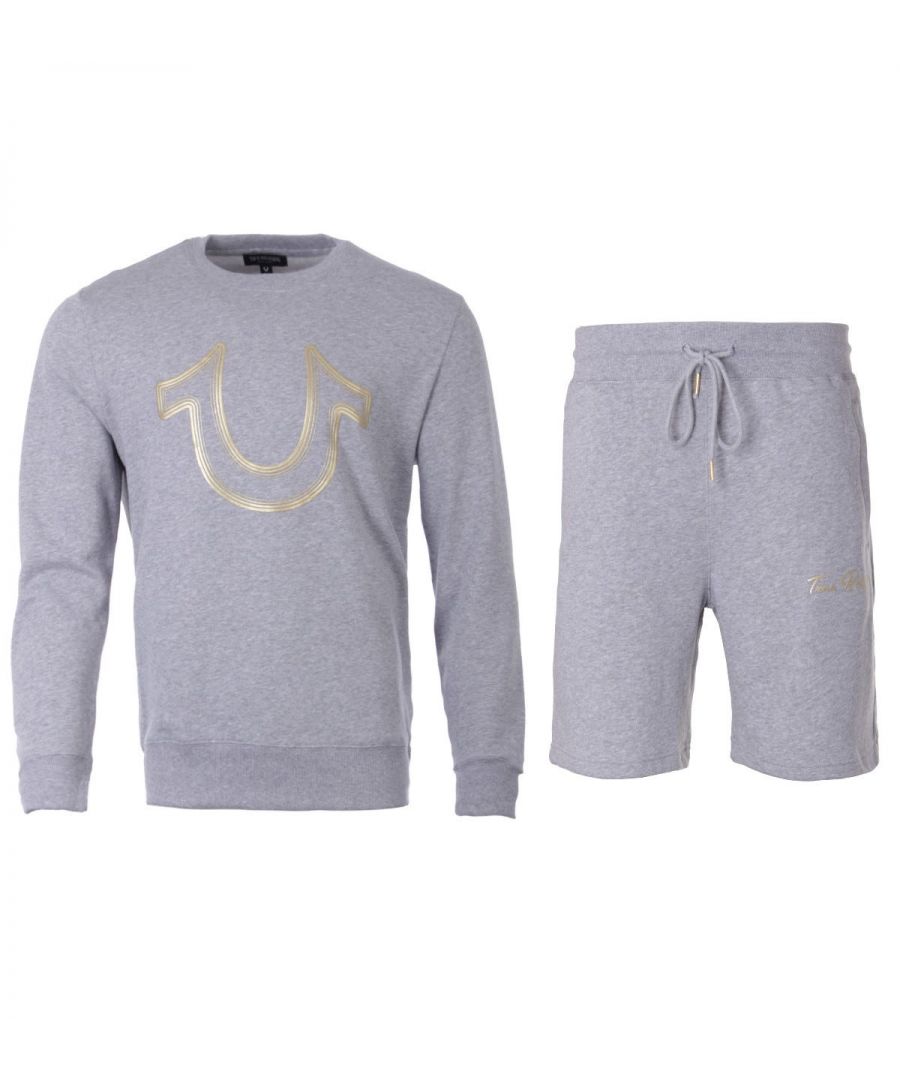 The Horseshoe Foil Logo Sweatshirt and Shorts Set from True Religion boasts their bold designs with supreme comfort. Both pieces have been crafted from a soft cotton blend providing comfort and breathability. The shorts are fitted with a drawstring waist and three pockets, whilst the sweatshirt is fitted with crew neck collar, long sleeves and ribbed trims. Both finished with iconic True Religion branding. Regular Fit, Cotton Blend Composition, Crew Neck Sweatshirt, Drawstring Waist Shorts, True Religion Branding. Style & Fit: Regular Fit, Fits True to Size. Composition & Care:60% Cotton, 40% Polyester, Machine Wash.