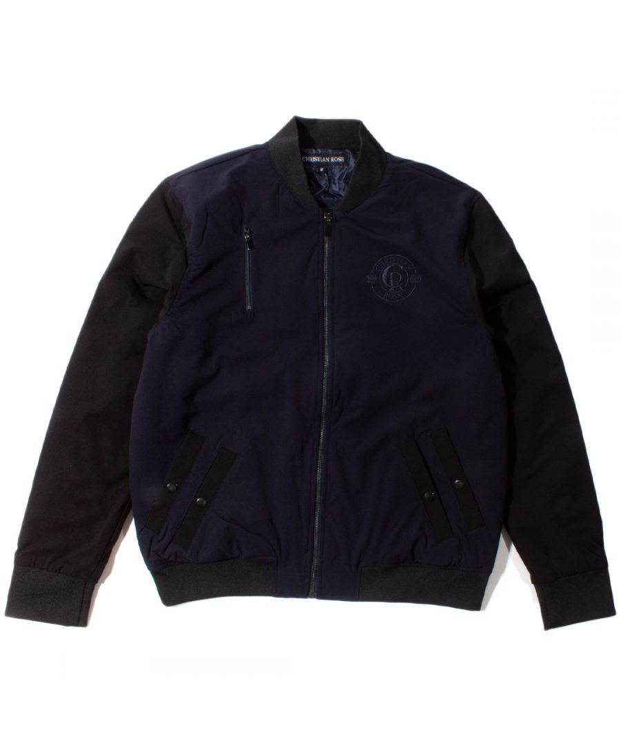 This Navy and Black bomber jacket by Christian Rose features the brand design embroidered on to the front left chest of the jacket. Popper button closure pockets on the front and also a classic bomber style zipper pocket on the chest.