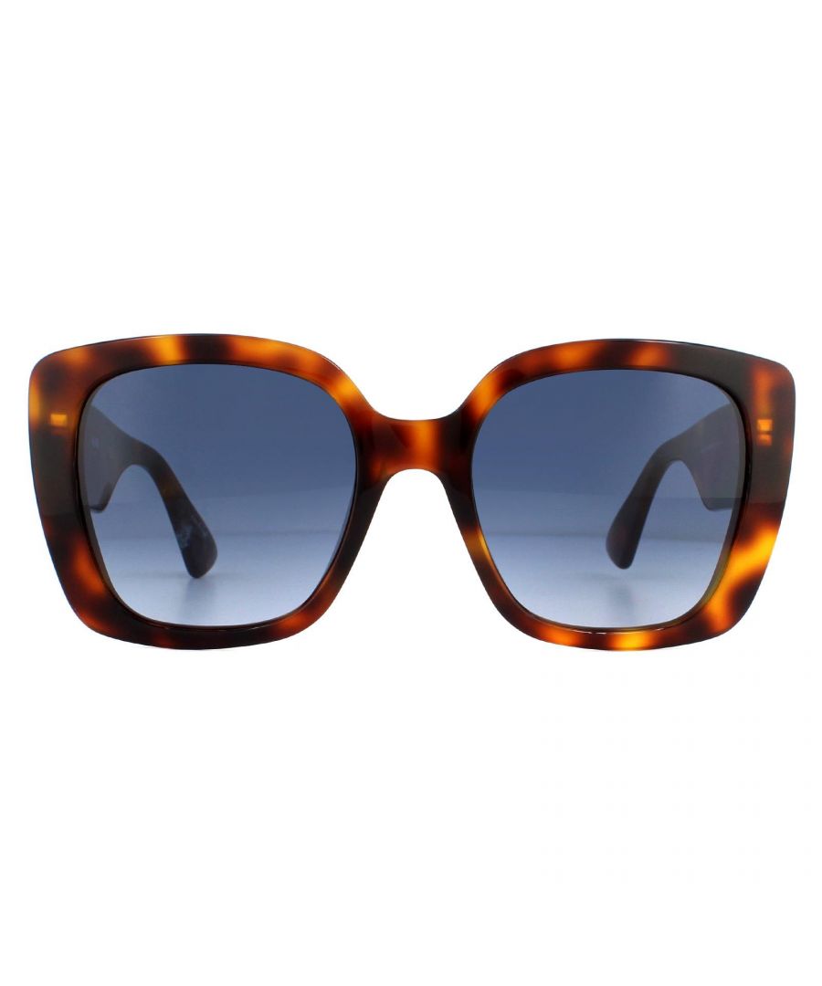 Moschino Sunglasses MOS016/S 086 08 Dark Havana Dark Blue Gradient are a typically bold choice from Moschino with these large oversized square shaped sunglasses. They feature a familiar dot pattern around the Moschino logo on the temples that enhances the glamorous finish.