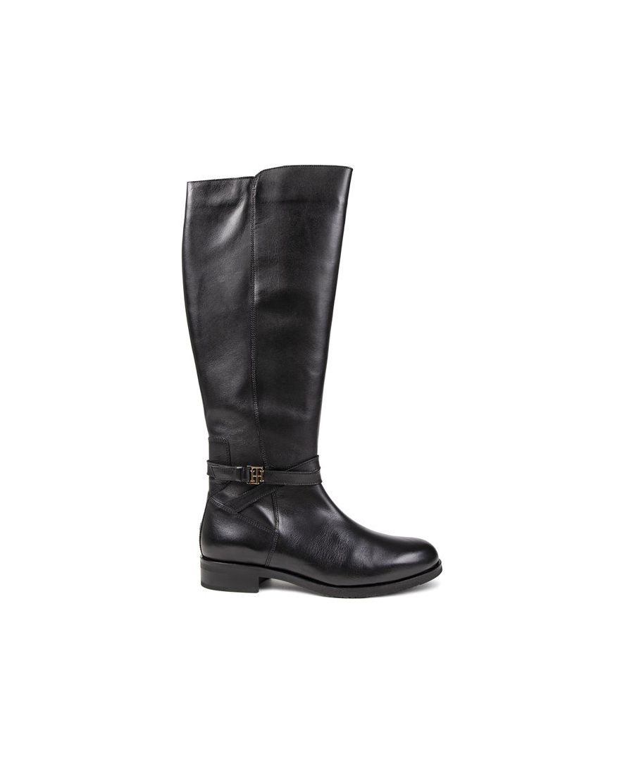 Women's Black Tommy Hilfiger Hardware Belt Knee High Boots With Premium Leather Upper Featuring Wrap Around Ankle Belt With Gold Th Logo And Iconic Flag Logo On The Heel. These Ladies' Luxury Boots Have A Full Inside Zip Fastening And Branded Synthetic Sole With Initial Th Tread.