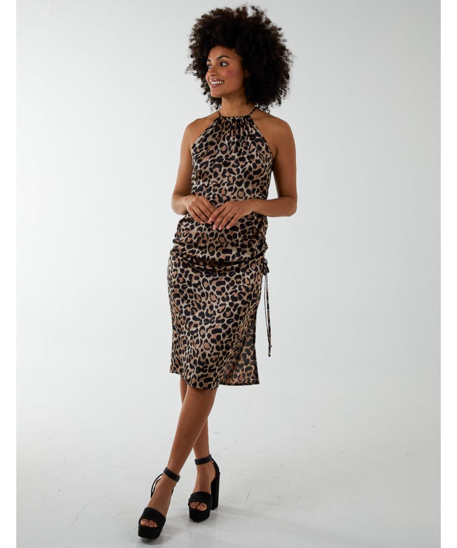 A daring dress for you to break rules with this season. Halterneck style, animal print and midi length are all elements that make this dress the ideal choice for a date night. High heel strappy sandals and a black coat can turn this dress into everything you've been looking for. 