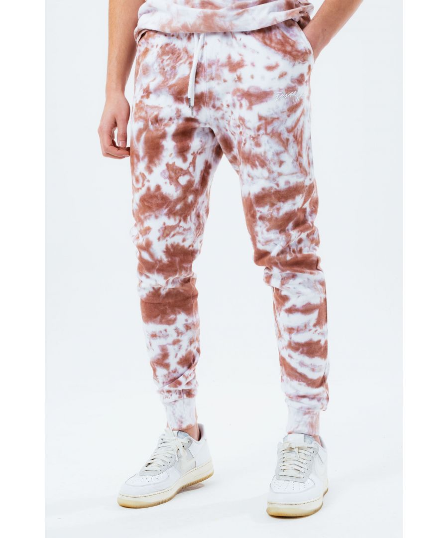 Stay on trend with the Hype Beige Tie Dye Scribble Logo Men's Joggers and grab the matching hoodie to complete the set. Designed in a soft-touch 70% Cotton 30% Polyester fabric base with the supreme amount of comfort you need from your new joggers. The design boasts an acid wash or tie-dye wash finish with an elasticated waistband, drawstring pullers and fitted cuffs. Machine wash at 30 degrees.