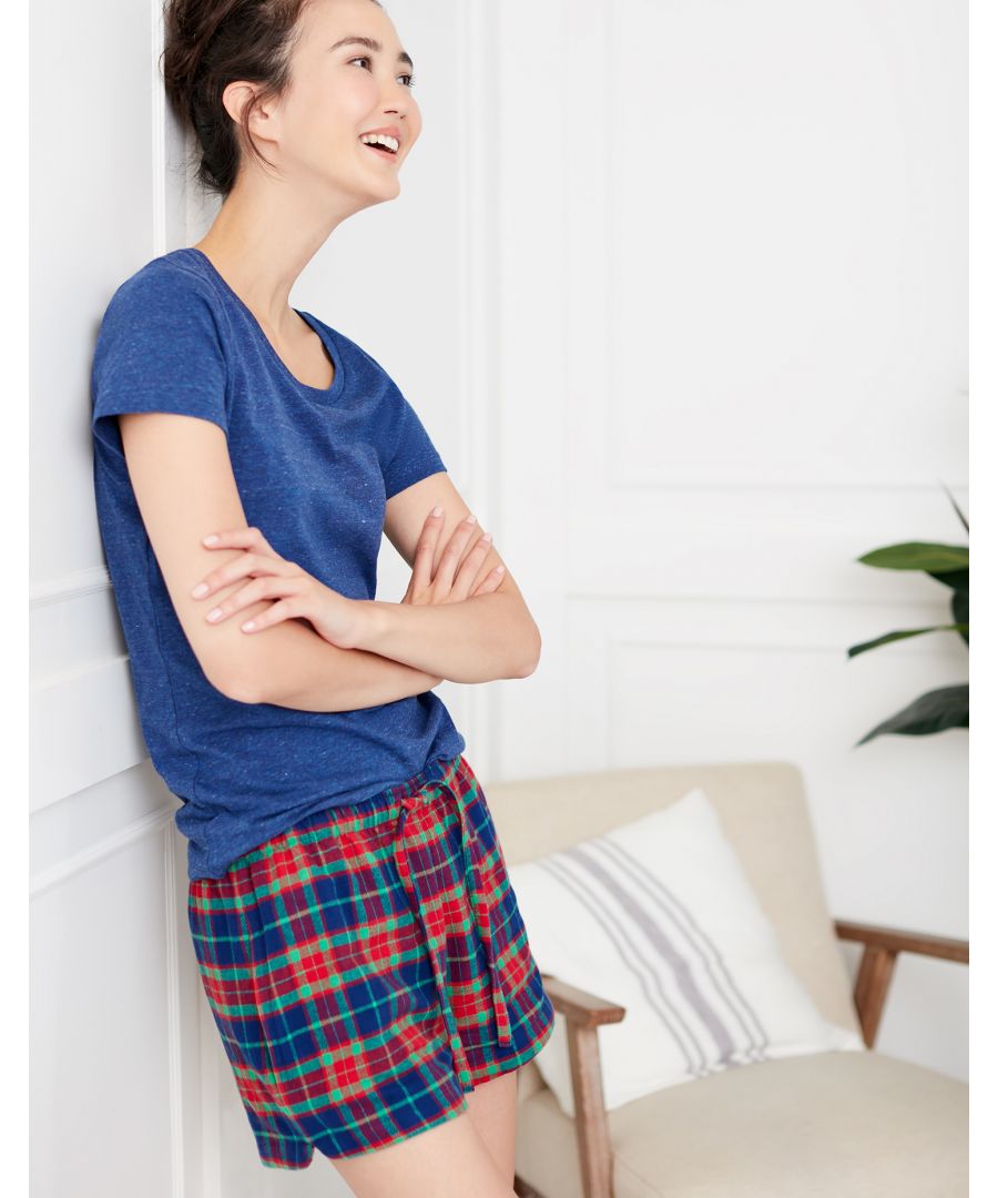 Slip into something more comfortable, night or day. It is the fabric of these pyjama shorts that makes them exceptional. The fibres in the cloth are initially dyed to our own colour specification, then brushed repeatedly to make them super soft, and finally woven with skill to our in-house design. Each pair features a tie waist, softly rounded side vents at the hem, and handy side pockets (by popular demand!). If you're unsure about which size to choose, we recommend rounding up for a looser fit and maximum comfort. Team these shorts with our organic-cotton tees or vests.  Available in sizes XS - XXL.  Machine washable to 40 degrees.  100% brushed cotton.
