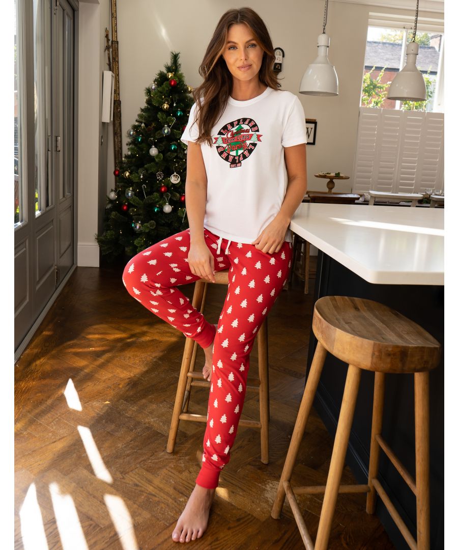 Festive pyjamas to help celebrate the most wonderful time of the year. This adorable pyjama set from Threadbare features a short sleeve top and long cuffed bottoms. Made from super soft cotton for comfortable wearing and easy washing. The top has a Xmas graphic print, short sleeves, and ribbed elasticated crew neckline. The cuffed bottoms feature an all-over print, elasticated waistband and drawcord. Other festive styles and colours available. Similar designs are also available for Kids for a family coordinated set.