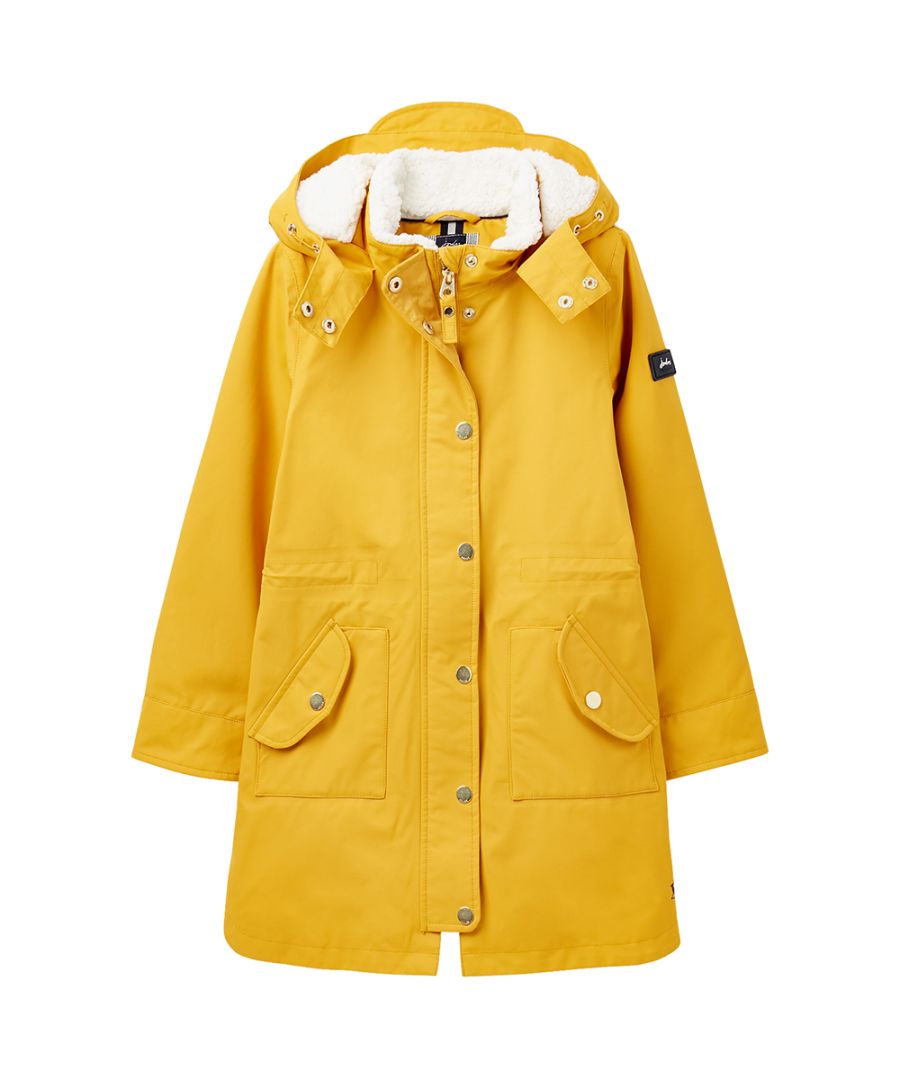 Longline coat. Cosy feel. Waterproof coat. Zip and popper fastenings. Drawcord detachable hood. 2 front pockets with popper fastenings. Borg lined. Waterproof. Breathable. Taped Seams. Padded. Main 63% Cotton / 37% Polyamide, Lining 100% Polyester.