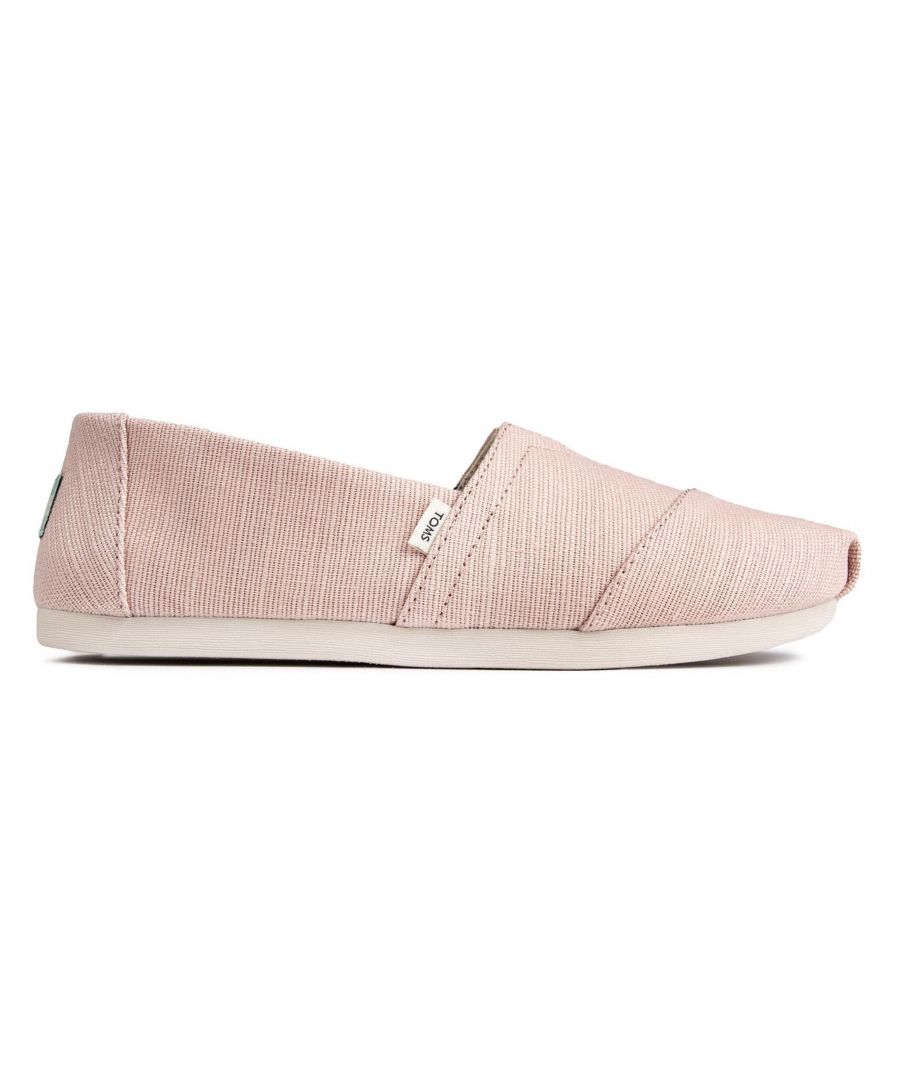 Step into effortless style and comfort with these classic slip-on plimsolls.\n\nCrafted with care and attention to detail, these plimsolls feature a charming pink canvas upper that adds a touch of femininity to your everyday look. The slip-on design allows for easy wear and removal, while the elasticated V-panel ensures a secure fit and flexibility.\n\nThe Toms Alpargatas Slip-On Plimsolls prioritize comfort. The cushioned insole provides softness and support, making them perfect for all-day wear. Whether you're running errands, exploring the city, or simply lounging around, these plimsolls keep your feet feeling comfortable and at ease.\n\nThe durable canvas construction of these plimsolls ensures longevity and withstands daily wear. The rubber outsole offers reliable traction on various surfaces, providing stability and grip with every step.\n\nNot only do these plimsolls prioritize comfort and durability, but they also embody Toms' commitment to giving back. With every purchase, Toms helps improve the lives of people in need by providing shoes, sight, water, and safe birth services to communities around the world.\n\nIn addition to their comfort and social impact, the Toms Alpargatas Slip-On Pink Canvas Women's Plimsolls (Model: 10016522) showcase a versatile design that effortlessly complements your casual outfits. The pink canvas upper adds a pop of color and pairs well with a range of looks, from jeans and shorts to skirts and dresses.