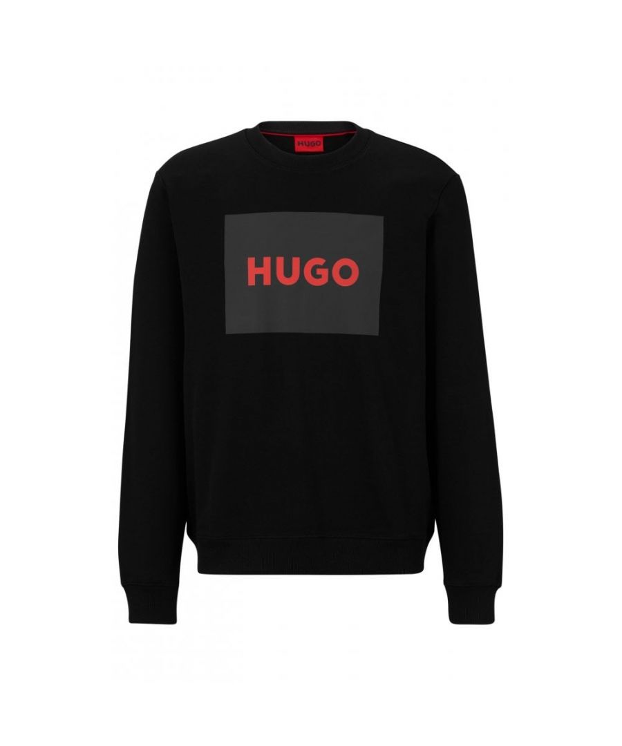 A versatile sweatshirt by HUGO Menswear. Printed with a statement HUGO logo in signature red, this crew-neck sweatshirt is cut to a straight fit in French terry made from pure cotton.\nRegular fitCrew neckLong sleevesRibbed cuffs\n100% Cotton, Waistband: 96% Cotton, 4% Elastane\n50467944