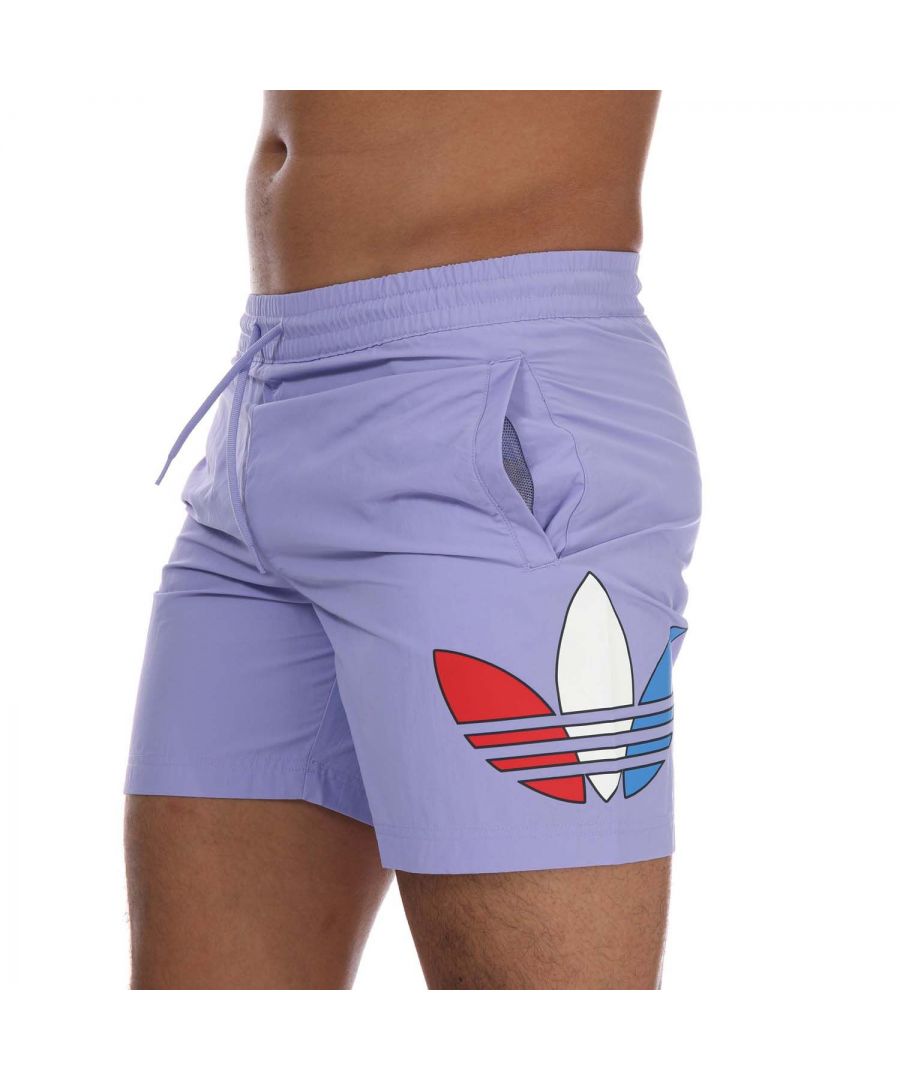 Mens adidas Originals Adicolor Swim Shorts in purple.- Drawcord on elastic waist.- Side welt pockets.- Back patch pocket.- Tricolour Trefoils on the sides.- Mesh lining.- Regular fit.- Main material: 100% Polyester.- Ref: GN3569