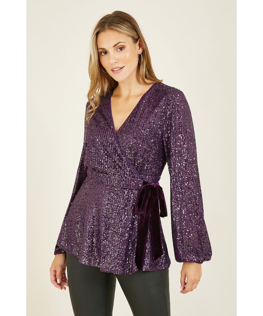 Going *out out*? Elevate your 'jeans and a nice top' fit selection with this showstopping Yumi Purple Sequin Wrap Top With Velvet Tie. With all over purple sequin detailing, flatter your curves with this wrap around shape, long balloon sleeves and velvet detail detail. Match with jeans or leather trousers and strappy heels.
