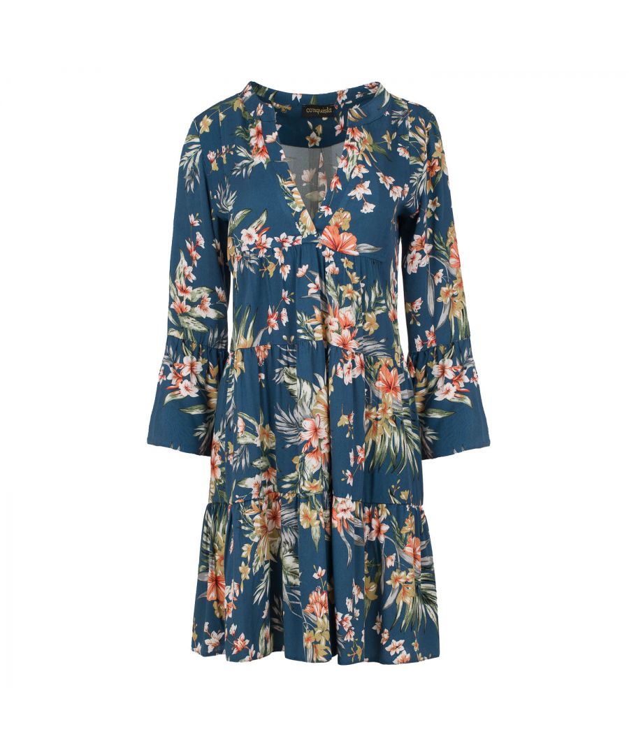 This floral dress with gathered seams is crafted in allover print woven viscose with a blue background. It has ¾ bell sleeves and a round neckline with a 24cm V opening in the front. There is a press stud on the inside at the bottom of the V to prevent it opening too much. There is oblong shaped double fabric below the V opening in the front. The dress has two 24cm wide ruched panels. There is a double pleat in the back. The dress is styled in a loose A line silhouette and hits above the knee.