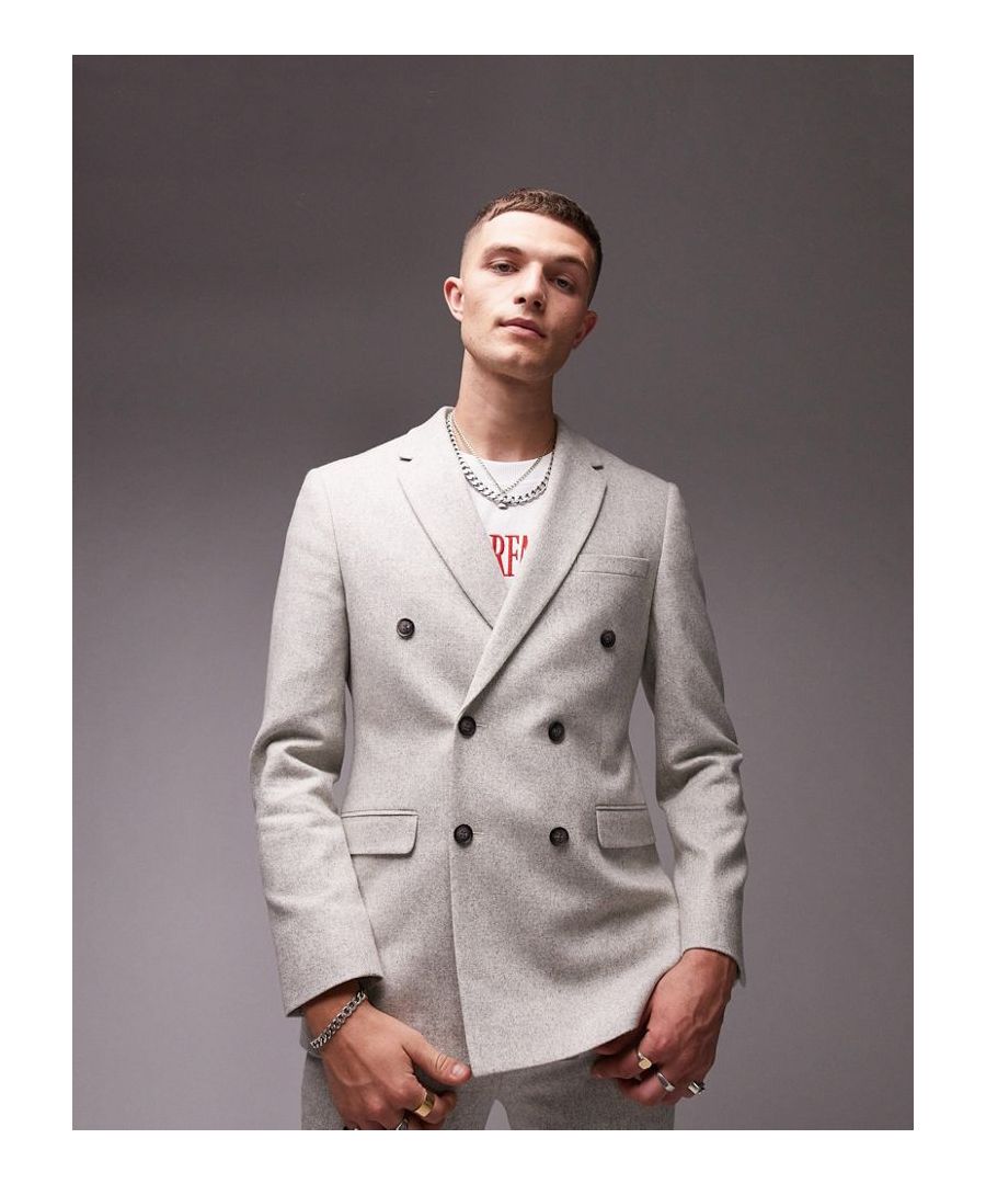 Suits by Topman Welcome to the next phase of Topman Brushed finish Notch lapels Padded shoulders Double breasted Button front Pocket detail Skinny fit Sold by Asos