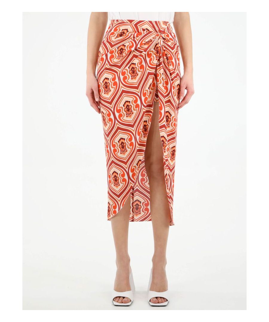 Sarong skirt with all-over orange graphic print. It features front draping and rear zip and metal hook fastening. The model is 178cm tall and wears size 40.