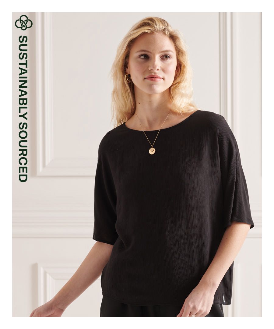 Sophisticated and minimal; the studios woven top will make a great new addition to your wardrobe this season. Style with jeans and boots to complete the look.Loose Fit – where comfort meets cool, a stylish loose cut makes this a must-have shapeShort sleevesKeyhole tie fasteningSignature logo tabMade using ECOVERO™ – sustainably sourced from responsibly managed forests certified by the Forest Stewardship Council or the programme for Endorsement of Forest Certification scheme.