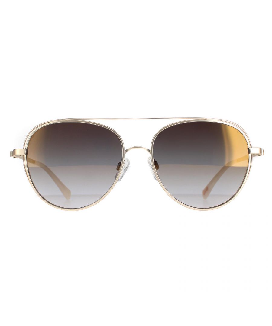 Ted Baker Aviator Womens Rose Gold Light Grey Gradient TB1575 Runa Sunglasses are a rounded pilot style but with an tended bar from the sides, up across the top of the frame. There is a bow detail on the temple on these gorgeous Ted Baker sunnies.