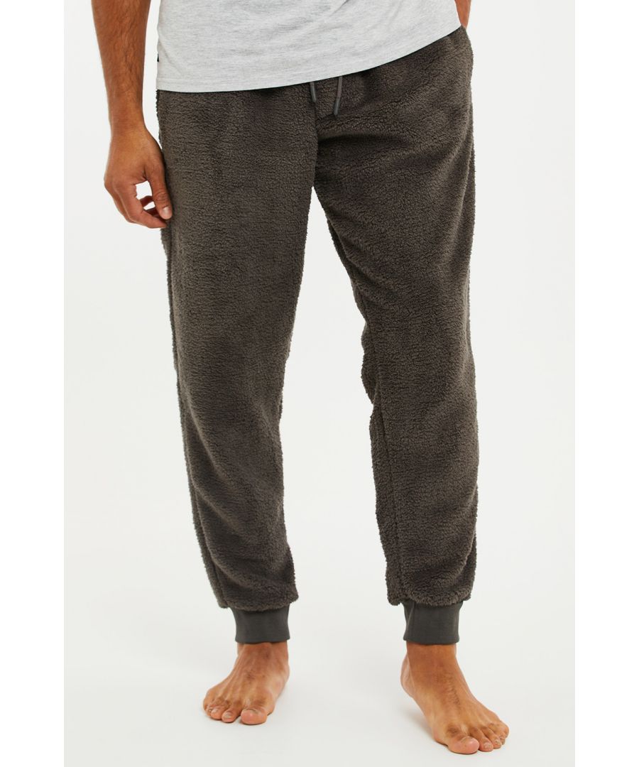 Relax in comfort in these loungewear joggers from Threadbare. These borg long pants have an elasticated waistband with drawcords for comfort, side pockets and ankle cuffs. The perfect pair of lounge pants to chill in on the sofa. Other colours available.