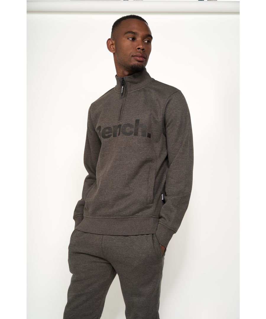 Upgrade any wardrobe with this 'Plinth' 1/4 zip sweatshirt from Bench. It features a rubber Bench logo print on chest, two pockets, ribbed hem and cuffs. Pair with matching joggers or jeans to complete the look. Available in other colours.