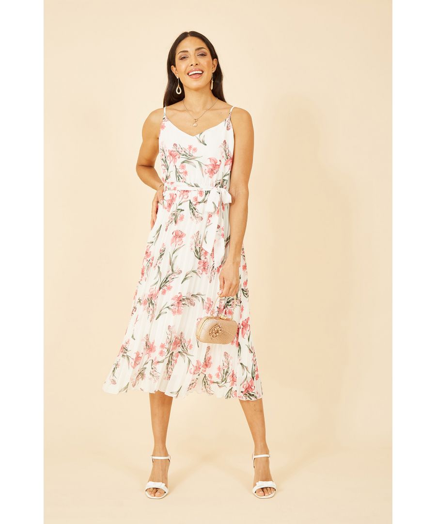 The perfect partner for parties, this dress from Mela is sure to have you feeling like a million dollars. The midi length skirt is enhanced with pleats and a gorgeous all over floral print. The strappy v neckline balances the shape and the tie waist highlights the silhouette. Wear with sandals and gold jewellery for opulent style.