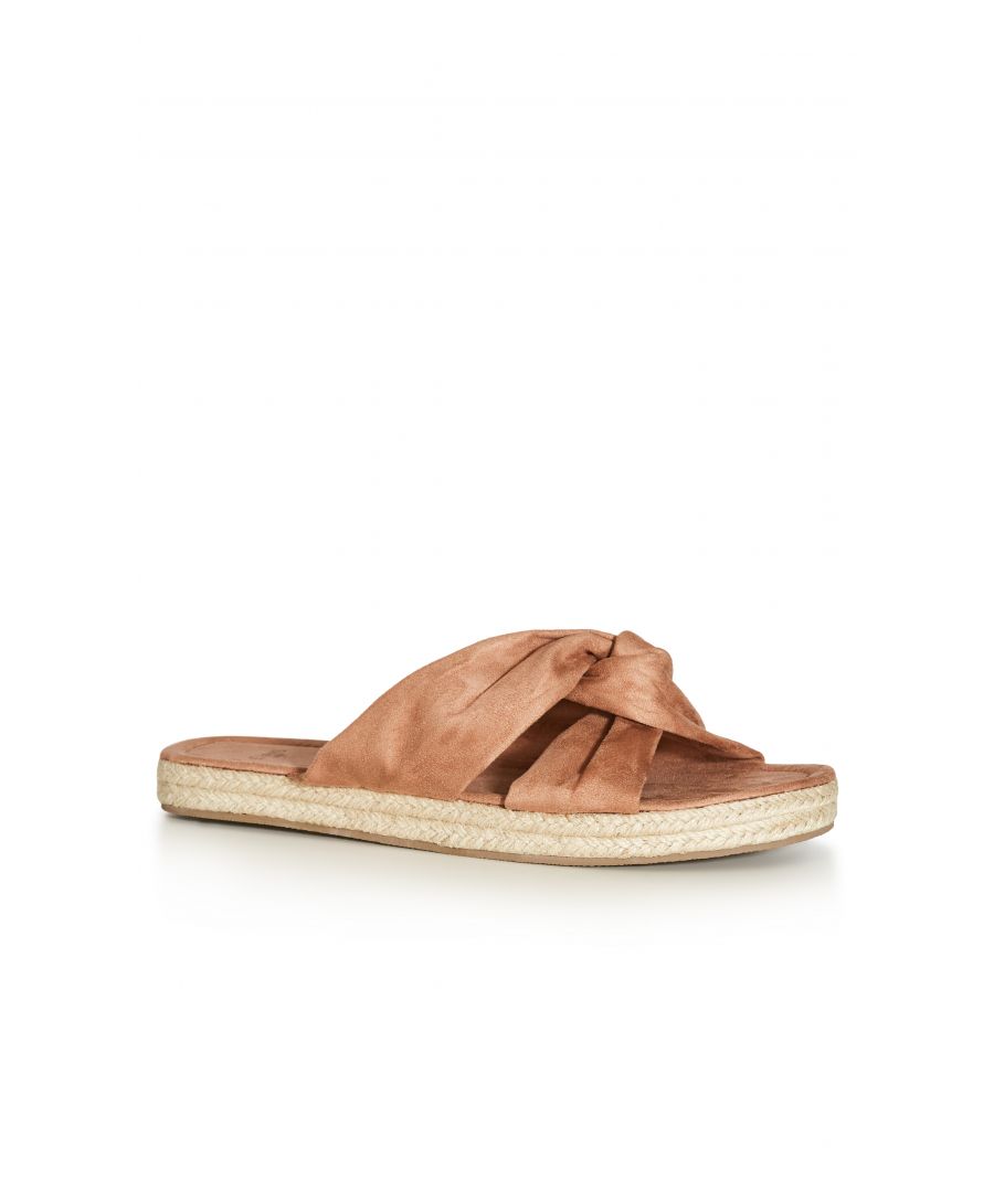 Chic and oh-so comfortable, the Softie Knot Flatform is a fun-loving pick for the warmer seasons. Featuring a knotted toe strap and woven flatform sole, these laidback shoes have us dreaming of tropical getaways and sun-soaked days spent seaside. Key Features Include: - Round toe - Knotted toe strap - Faux suede fabrication - Slip on style - Contrast chunky woven sole Upstyle your holiday attire with a dreamy maxi dress, oversized sunglasses and chic straw hat.