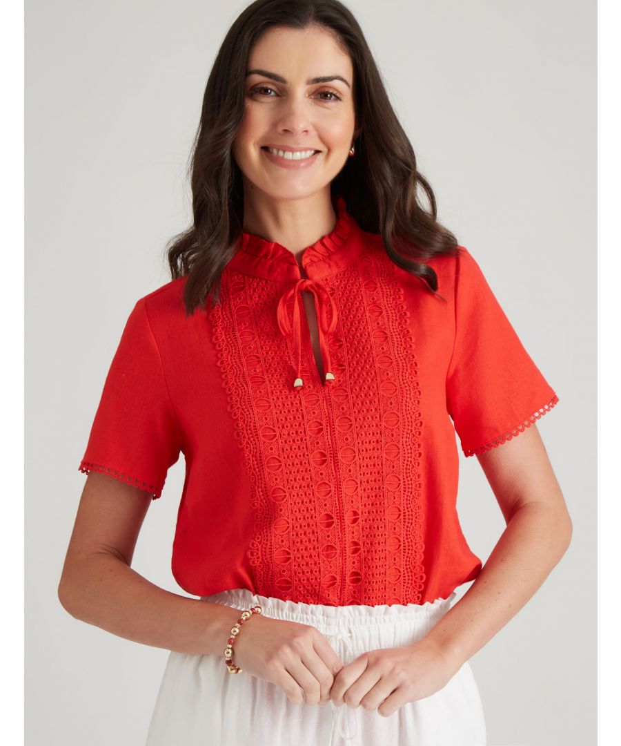 With a relaxed fit and a graphic print, this red blouse is perfect for the summer season. With cropped sleeves that are short, it's a great choice for those hot days spent outdoors. The neckline details is a band around the neck that gives it an extra pop of color. If there's one thing we know, it's that fire always looks good (and feels even better). So why not channel your inner arsonist with this fiery red blouse? Made from a sturdy and durable fabric, this piece is perfect for those days where you don't want anything restricting your movements. The graphics print will set off your outfit in all the right ways, while the comfortable fit ensures that you can wear it all day long without feeling uncomfortable or restricted. The cropped top length leaves room for movement and breathability, so you can really let loose during those scorching summer days. And if fashion isn't enough of a draw for you, consider pairing this amazing blouse with some jeans and sneakers for maximum impact. -- The all-new, orange red blouse is perfect for the summertime. Its relaxed fit and cartoon prints make it a hit with both women and men. The short sleeves ensure that you'll stay cool while wearing this top, and the neckline is Mock-neck style so you can display your collar bone proudly.  Prepare yourself for the heat of the summer season with this fiery red blouse. Made from lightweight but durable fabric, it provides coolness and ventilation in scorching weather conditions. The graphics print on this piece will make you feel like your own personal superhero; complete with flashy flames outlining your body. The collared neckline provides extra protection from the sun's harmful rays, while the cropped top length ensures that you look your best from every angle. Whether you are going out on dates or simply feeling confident and beautiful all by yourself, this blouse is perfect for any situation.Material:  55% Linen / 45% Viscose
