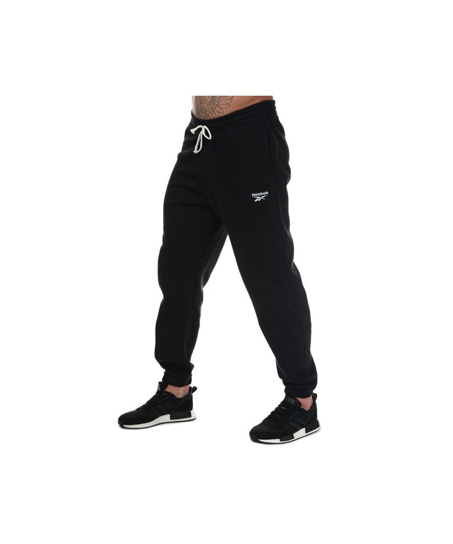 Mens Reebok Training Essentials Cuffed Pants in black.- Drawcord on elastic waist for secure  adjustable fit. - Slip-in front pockets.- Mesh-lined.- Speedwick fabric wicks sweat to help you stay cool and dry.- Slim fit.- Main material: 80%Cotton  20% Polyester. Machine washable. - Ref: FU3239