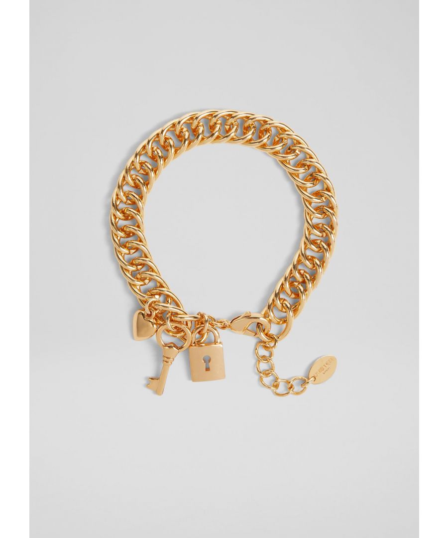 A contemporary take on the classic charm bracelet, our Adina bracelet teams up nicely with the Beatrice chain necklace. Crafted from gold-tone metal, it’s a chunky chain style with heart locket, key and padlock charms, and it’s finished with an adjustable-length clasp. Wear it to dress up bare arms over the summer months.  